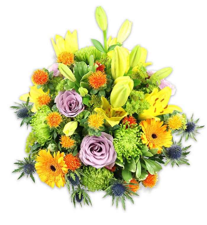 A densely packed, vividly coloured floral composition rests against a stark white background, conceived with the kind of hands-on care you'd expect from Florist Upper Norwood. Radiant yellow Asiatic lilies provide the primary vertical drama-some unfurled and speckled, others held as long, chartreuse-tinted buds-while two or three soft lavender-purple roses form a serene, spiralled centre that calms the more exuberant hues. Generous orange Gerbera daisies fan their petals outward like small suns, their darker centres drawing the eye, and abundant lime-green button chrysanthemums fill the spaces with a ruffled, textured volume that makes the bouquet feel almost like a living cushion. Scattered, smaller globe-shaped orange and golden accents bring playful texture and bright punctuation, contrasted by several blue-grey sea thistles (Eryngium) with their spiky, architectural bracts that give the piece a contemporary, slightly rustic edge. A mix of glossy and matte foliage frames every bloom, creating depth and natural movement under a soft, diffuse light that highlights each petal's surface. Close your eyes and you'd note a layered scent: the full, sweet perfume of lilies softened by the rose's powdery notes and the fresh green lift of foliage. Perfect as a celebratory centrepiece, a thoughtful congratulations gift, or a comforting bouquet to lift spirits, this arrangement reflects neighbourhood sensibilities-suitable for delivery around Church Road, West Norwood, and nearby streets-crafted with local knowledge and floral expertise.